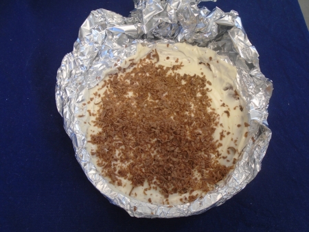 Cheesecake with chocolate shavings.