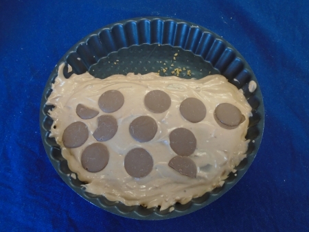 Cheesecake with chocolate buttons.